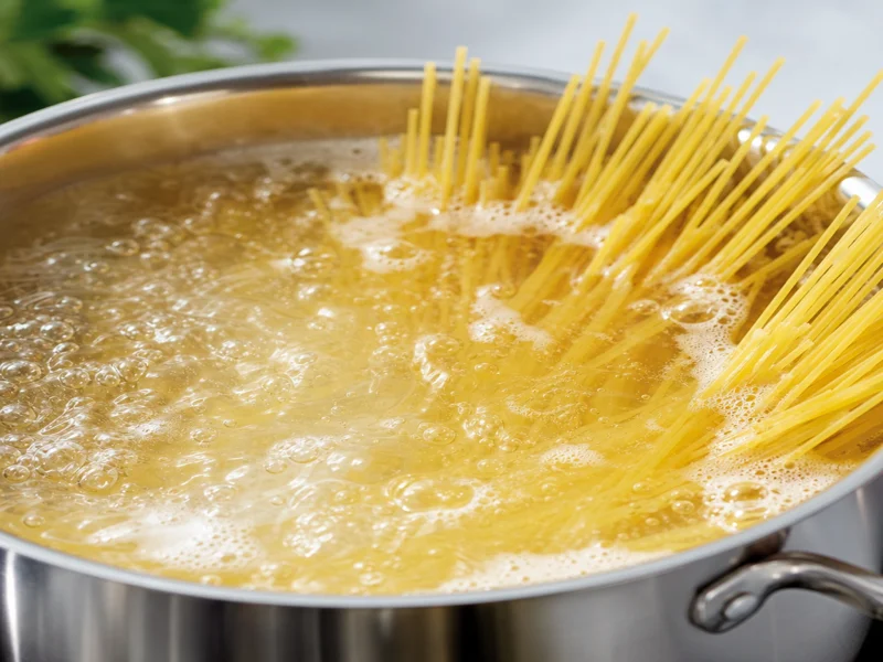 Spaghetti boiling in a large pot of water